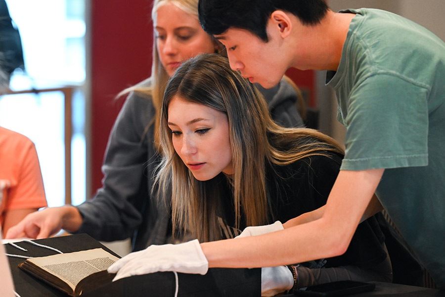 Students in Professor Taylor’s HIST 2220: Europe and the World class examine rare books from Special Collections in Fall 2023. Students in Professor Taylor’s HIST 2220: Europe and the World class examine rare books from Special Collections in Fall 2023.