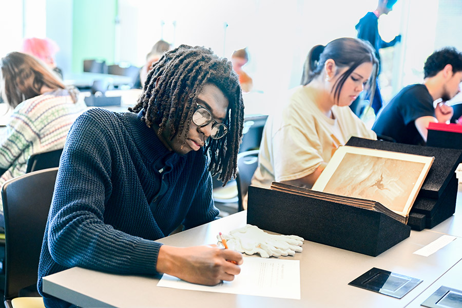 Students in Professor Kershaw’s ART 3999: Contemporary Art class take notes on materials from Special Collections in Fall 2024. Students in Professor Kershaw’s ART 3999: Contemporary Art class take notes on materials from Special Collections in Fall 2024.