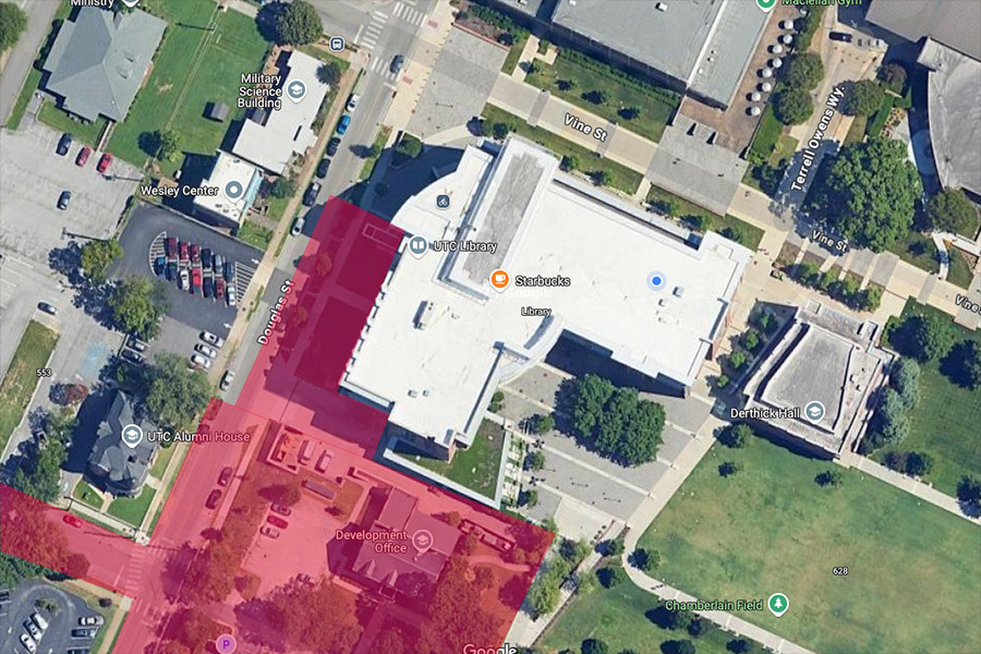 An aerial photo of the UTC Library showing construction areas in red