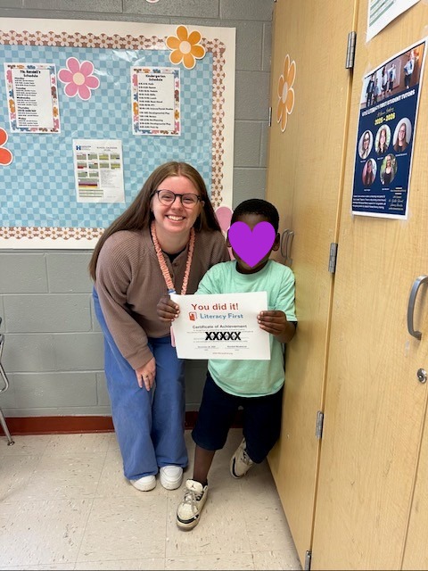 Tutor and Student holding a certificate