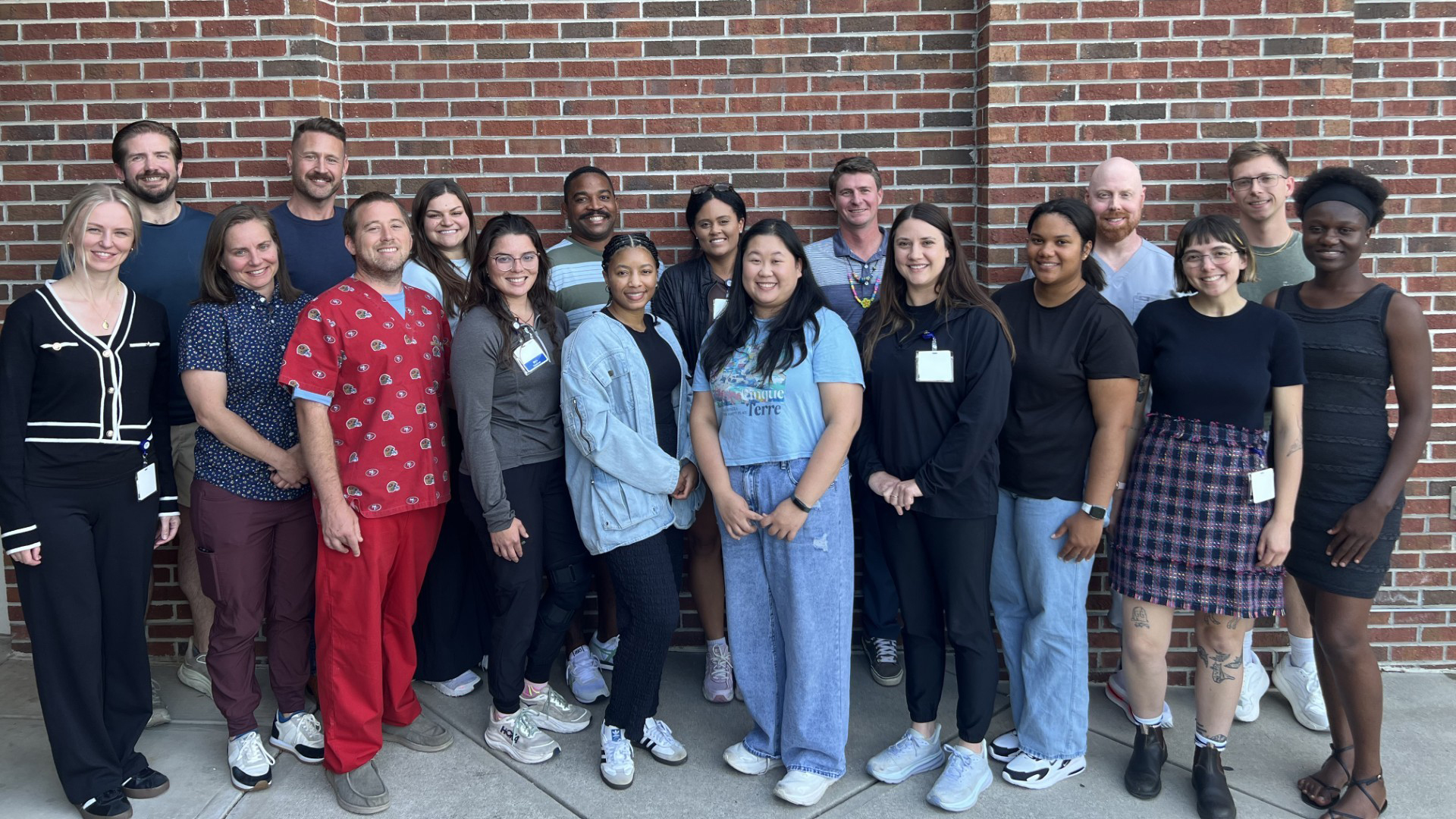 ABSN Students pose outside the Nursing building