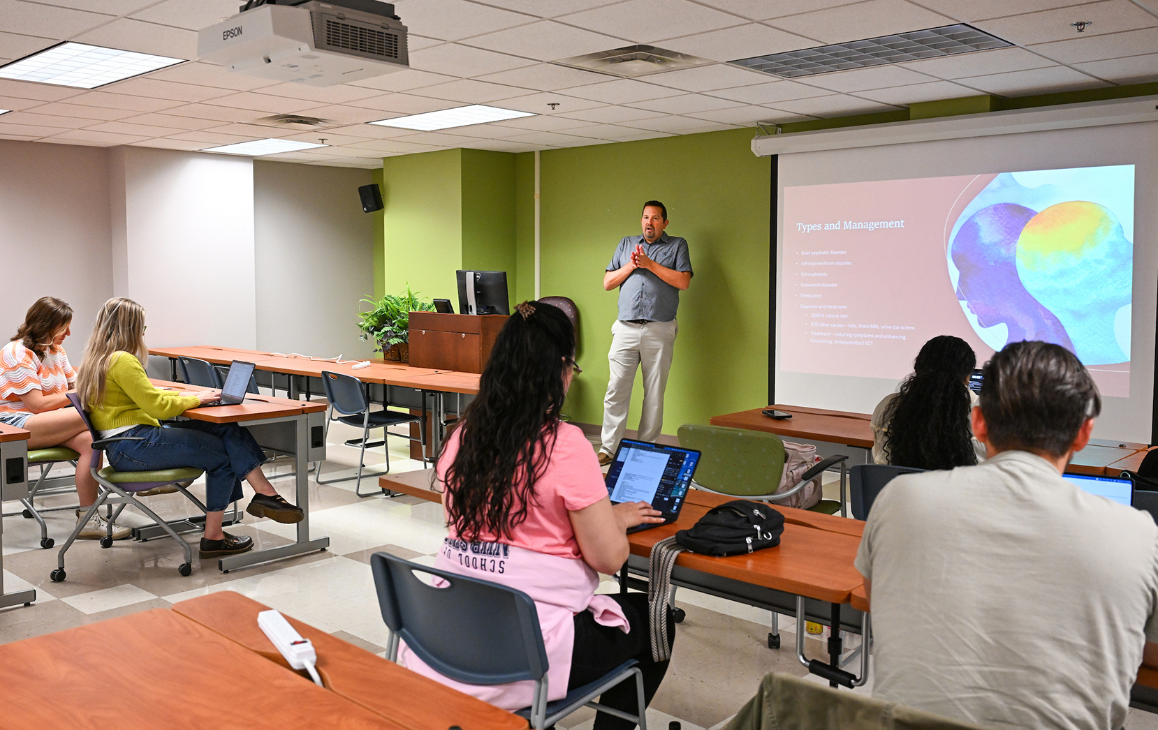 Dr. Jason Peter lecturing to students during a nursing class
