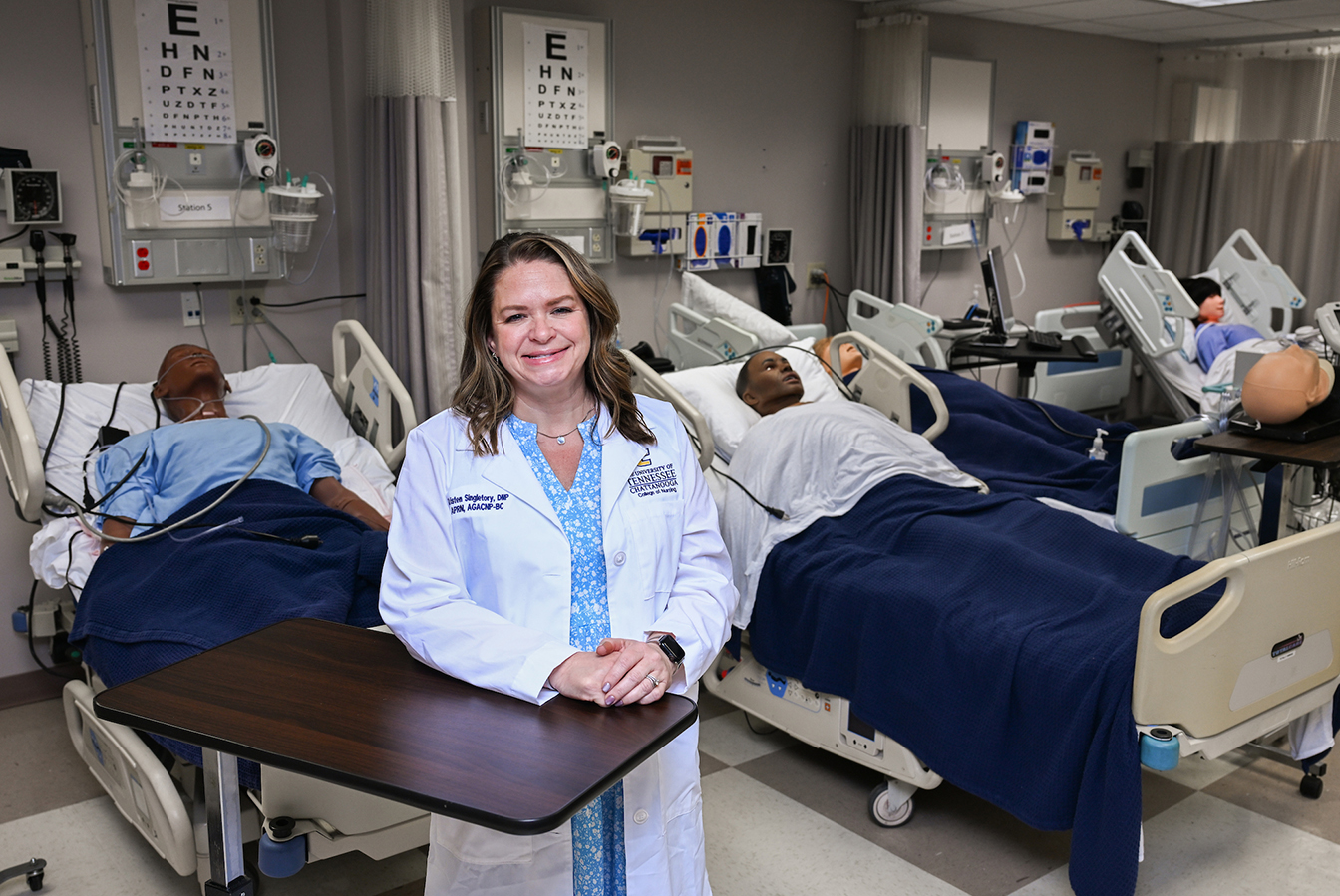 Dr. Kristen Singletary, director of the ABSN program, stands in a nursing simulation lab on campus.
