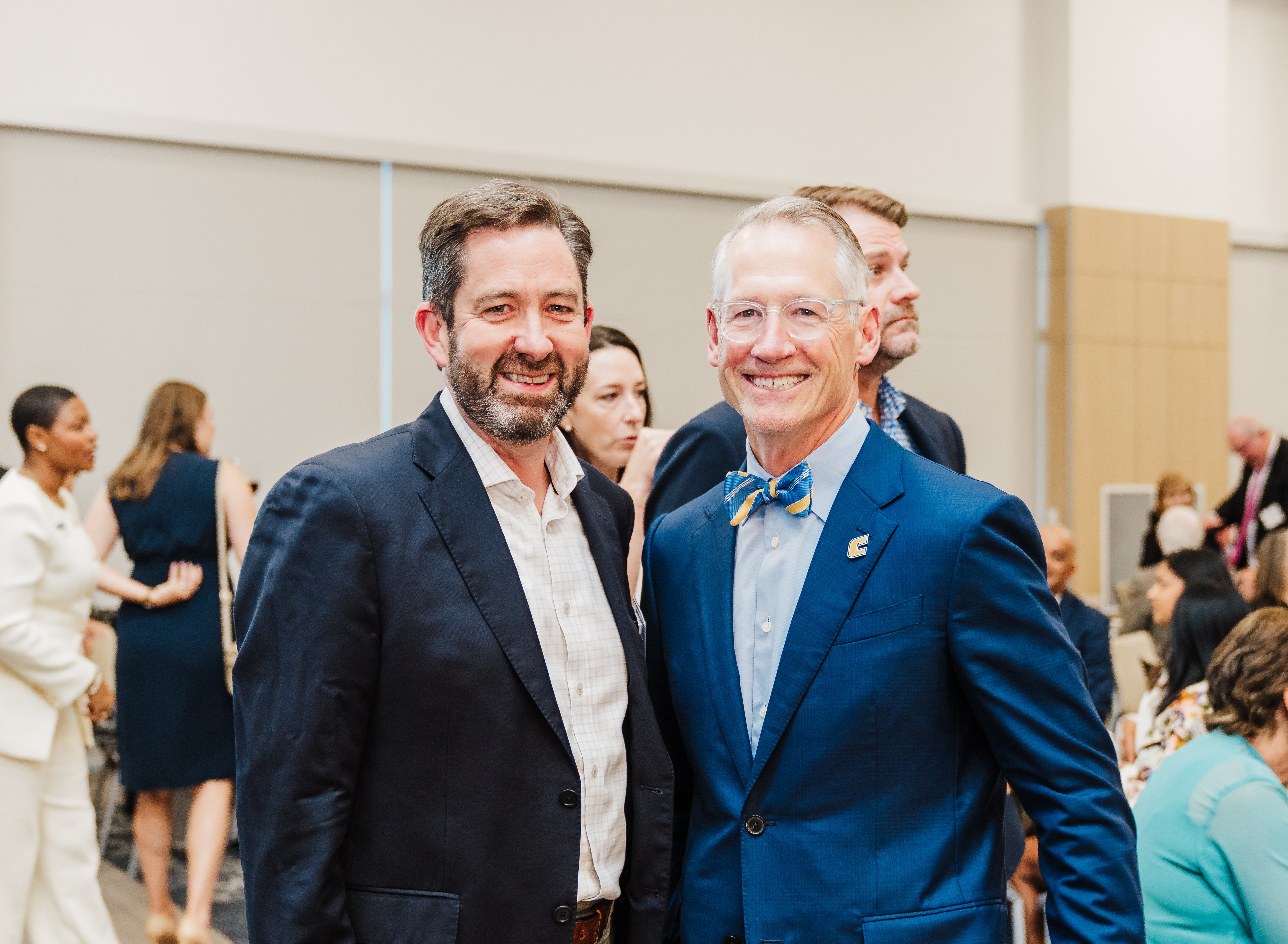 Two professionals attend a UTC event