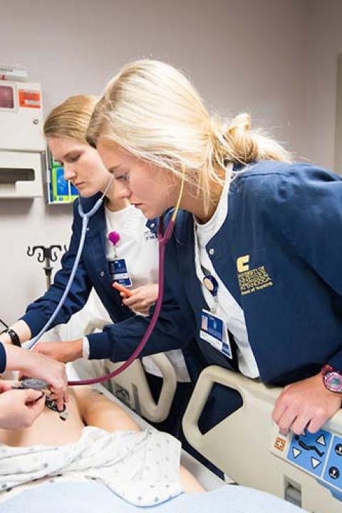 students tend to patient in nursing simulation