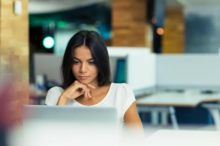 girl studying at a computer in a computer lab