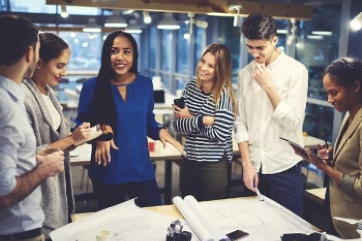 Woman coming up with great idea and everyone praising her