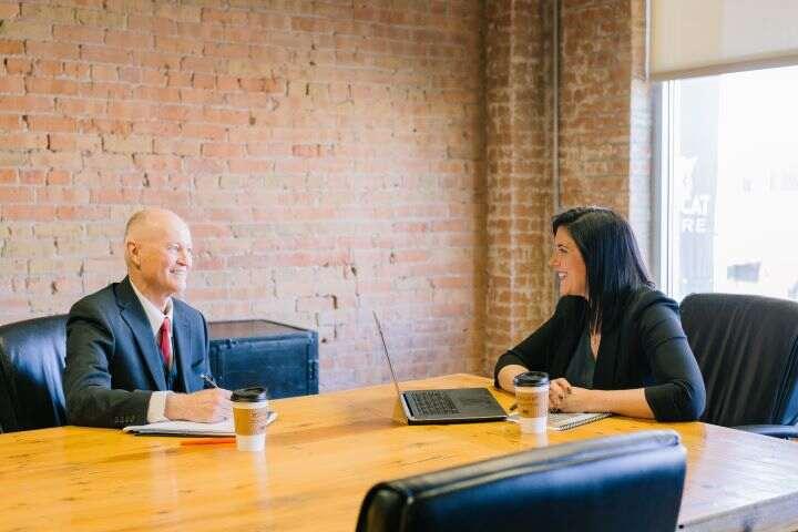 Woman and Man discussing business meeting