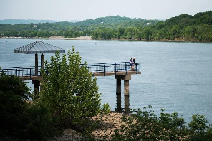 Couple on bridge overlooking water