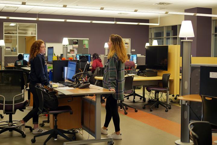 A student assistant helping a Studio user.