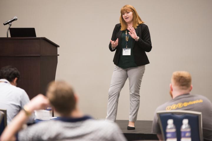 CIE Index Page 3 Woman presenting in front of classroom