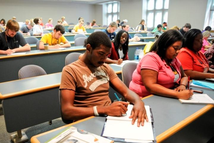 Classroom of students taking notes