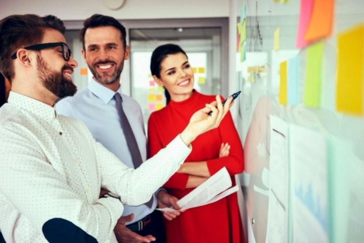 Group of professionals at white board