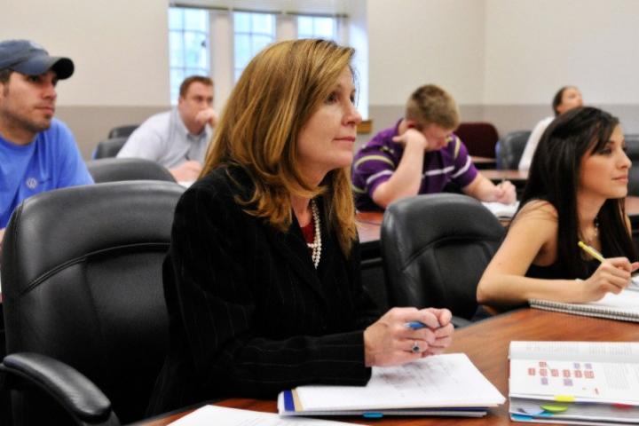 Woman at desk in lecture