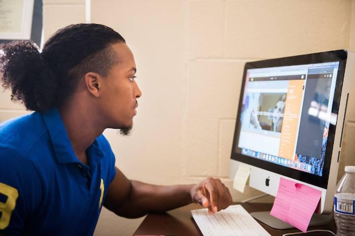 Student sits at a computer