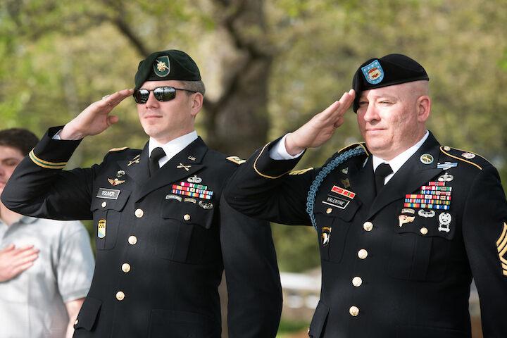 2 soldiers saluting