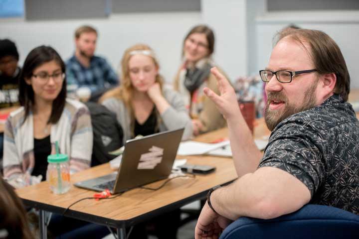 Students listening to the professor teach