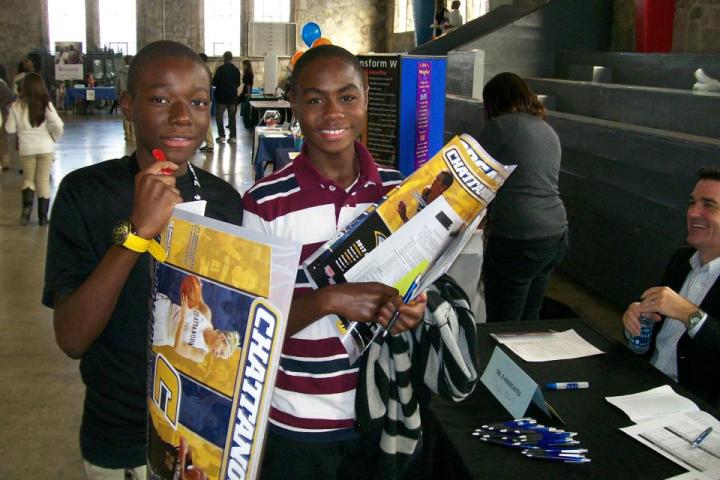 CCCE Talent Search Fair Two Students holding UTC gear