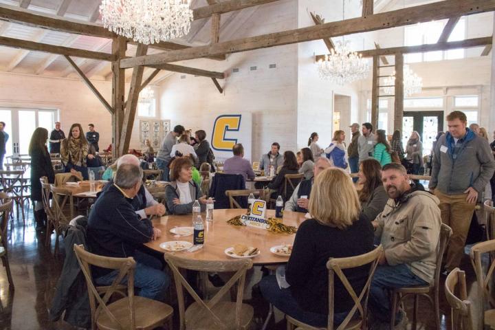 Alumni Fall Fest tables in an event space