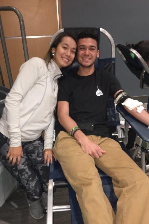 Man and woman giving blood