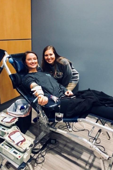 Girls giving blood