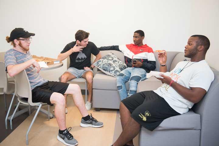Students lounging in dorm room