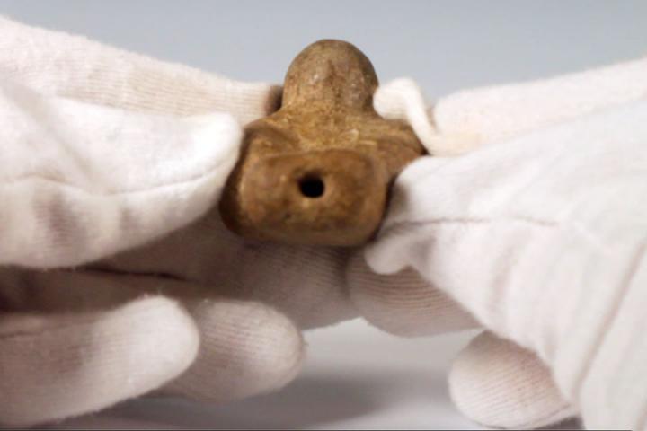 Pre-Columbian ceramic bird shaped figurine. A small hole in the tail and the breast suggest it functions as a whistle.