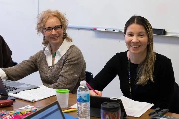 Students in a classroom having a conversation