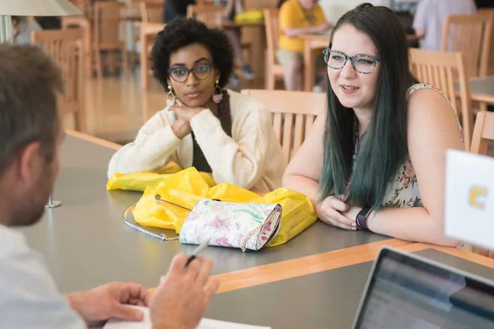 Students talking to an advisor