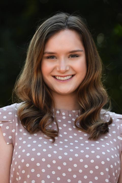 Halle McGuire Image of Halle McGuire- female with brown hair wearing a polka dot shirt