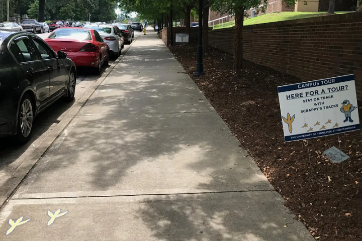 Tour marks on sidewalk