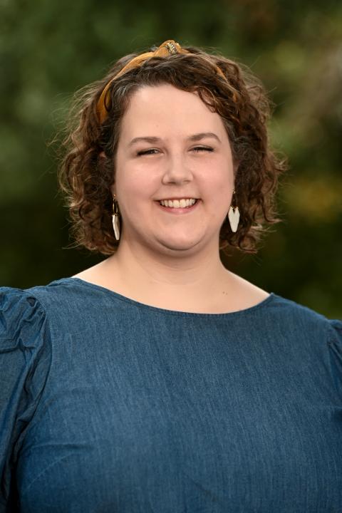 Laura Petrus, headshot in blue top.