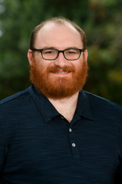 Benjamin Powell Benjamin Powell, headshot in blue polo