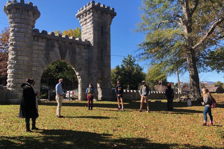 Students outside castle in grass