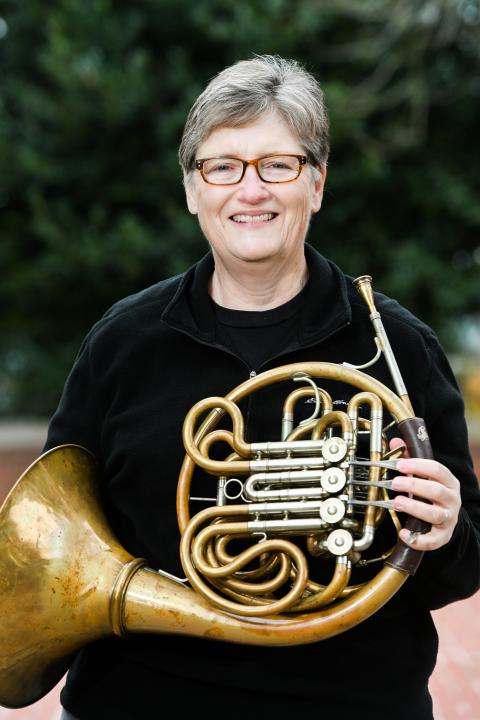 Jocelyn Sanders holding French horn