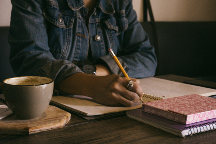 woman writing in notebook