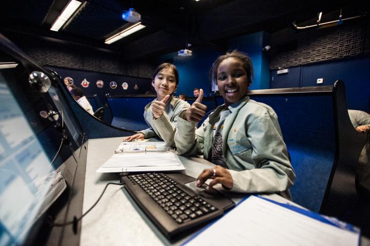 Young Learners Enjoying an Interactive Space Simulation at the UTC Challenger Center