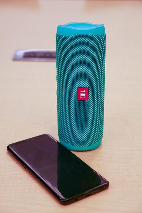 Bluetooth Speaker Bluetooth speaker next to phone