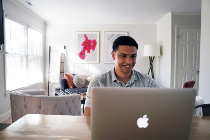 male coder typing at computer