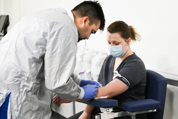 Phlebotomy Spring 22 male drawing a female's blood