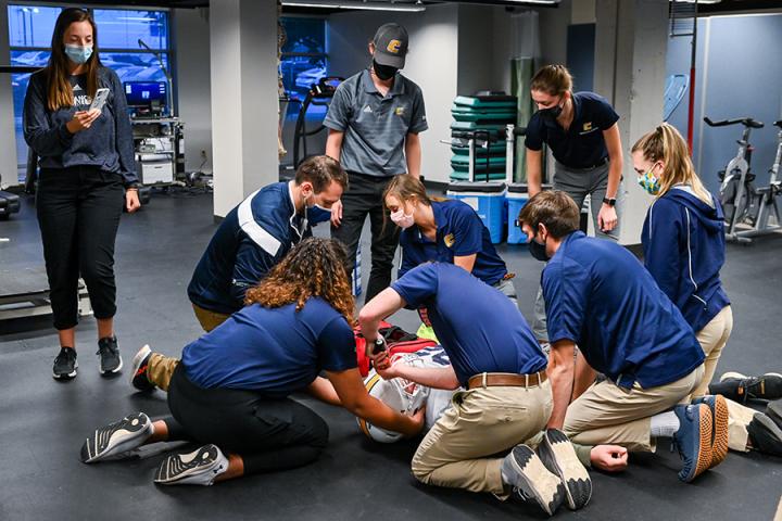 Athletic Training and Nursing students participate in an emergency drill Thursday, Nov. 4, 2021 in front of the Metro Building.
