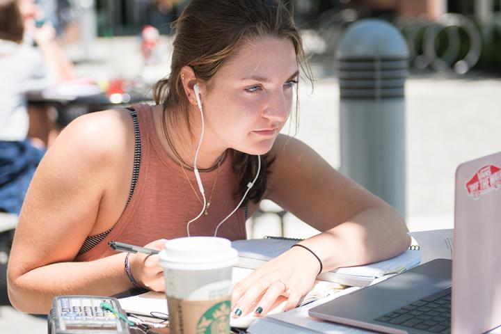 Female Studying with Starbucks Female Studying with Starbucks