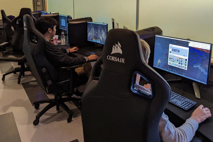 A group of students play Minecraft together in the University Center Esports & Gaming Facility