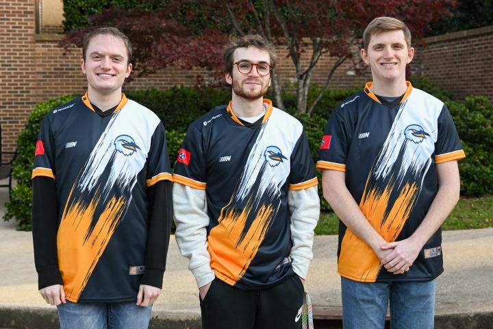 Fall 2022 League of Legends A team Three of the UTC League of Legends A team players pose in their jerseys.