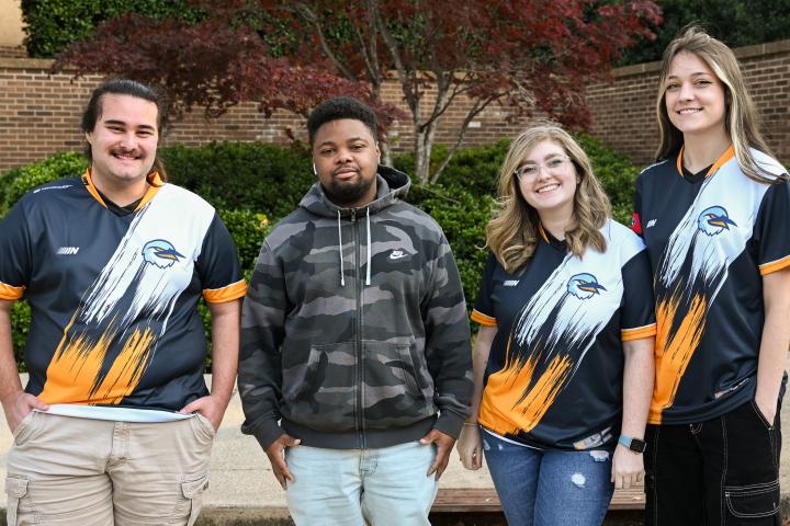 Fall 2022 League of Legends B team Four of the UTC League of Legends B team players pose in their jerseys.