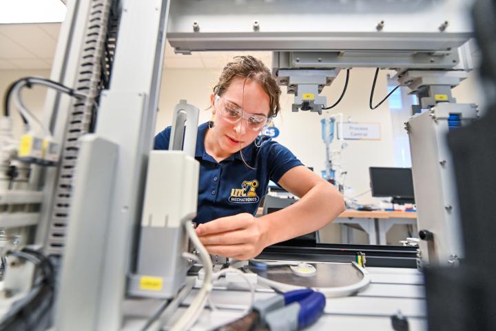 Mechatronics lab research Female student working in a mechatronics lab