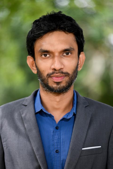 Profile photo of Ravinath Alahakoon wearing a blue shirt and gray jacket.