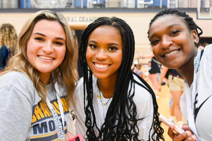 Three diverse female students. Three diverse female students.