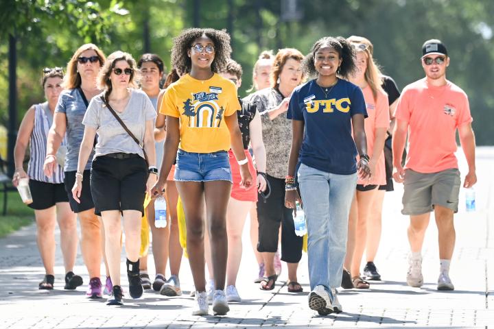 A campus tour group being led by a student leader
