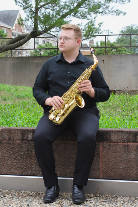 Photo of Jackson Thorpe holding alto saxophone
